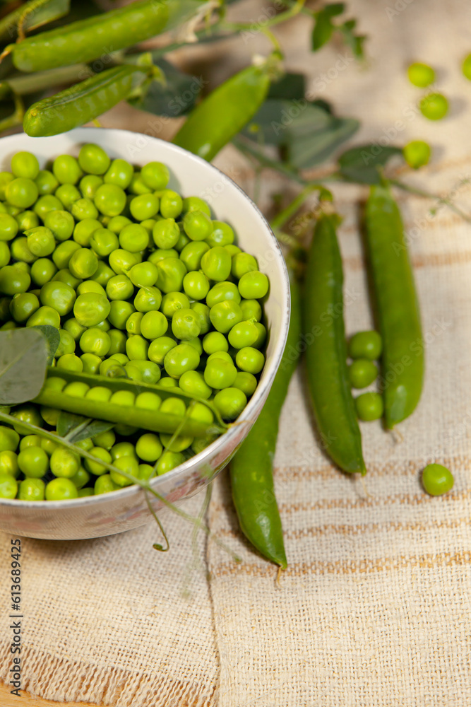 Sweet green peas in a bowl. Close-up.