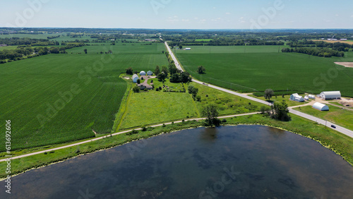 Aerial view over a pond in the summer in the farm land of Madison Wisconsin USA