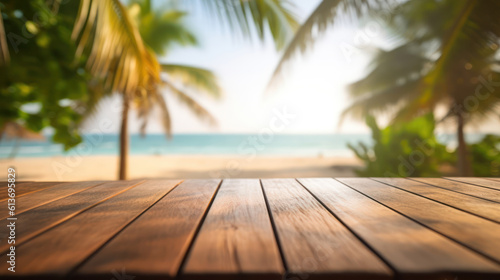 Empty wooden table top with blurred sunny beach with palms background