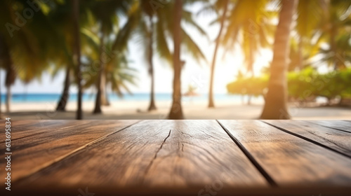 Empty wooden table top with blurred sunny beach with palms background