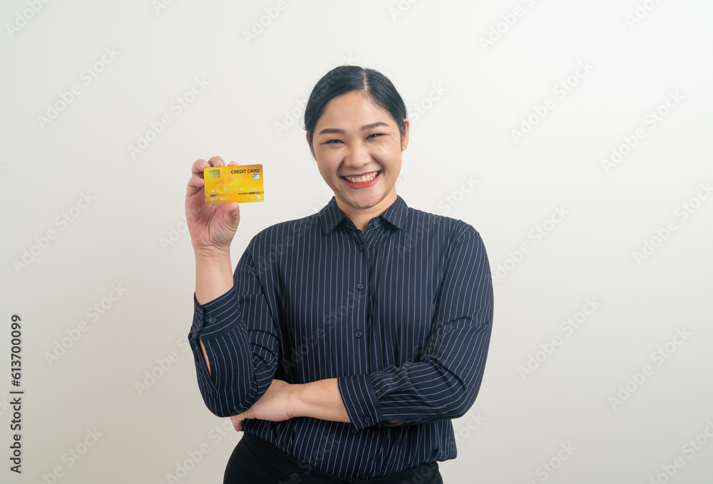 Asian woman holding credit card with white background Asian woman holding credit card with white background