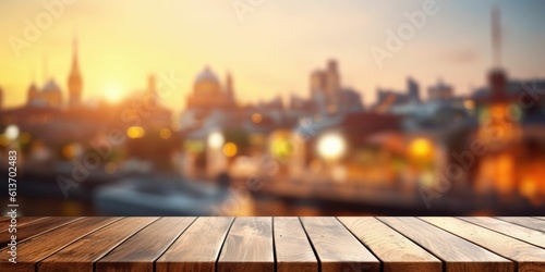 blank wood table top and a blurred city © Daunhijauxx