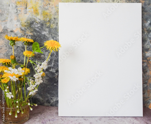 mockup picture next to a bouquet of flowers on a colorful background