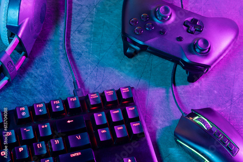 Top view of a gamer's workspace on a desk with an abstract carpet texture and lines.