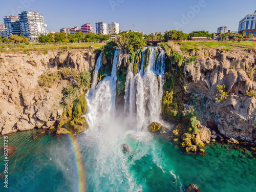 Fototapeta Naklejka Na Ścianę i Meble -  Lower Duden Falls drop off a rocky cliff falling from about 40 m into the Mediterranean Sea in amazing water clouds. Tourism and travel destination photo in Antalya, Turkey. Turkiye.