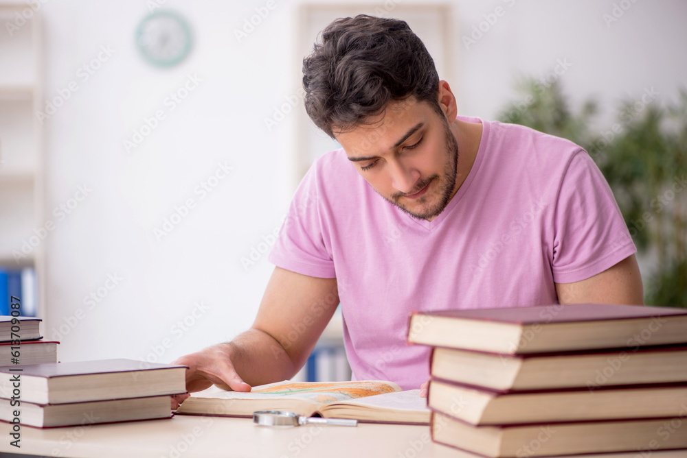 Young male student sitting in the classroom Young male student sitting in the classroom