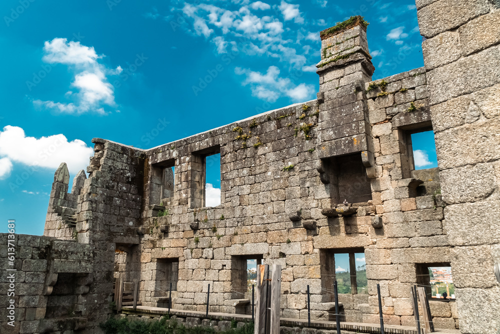 Guimaraes, Portugal. April 14, 2022: Walls and structures of Guimarães castle with blue sky. Guimaraes, Portugal. April 14, 2022: Walls and structures of Guimarães castle with blue sky.