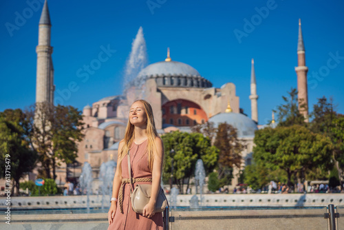 Photography Woman enjoy beautiful view on Hagia Sophia Cathedral, famous islamic Landmark mosque, Travel to Istanbul, Turkey