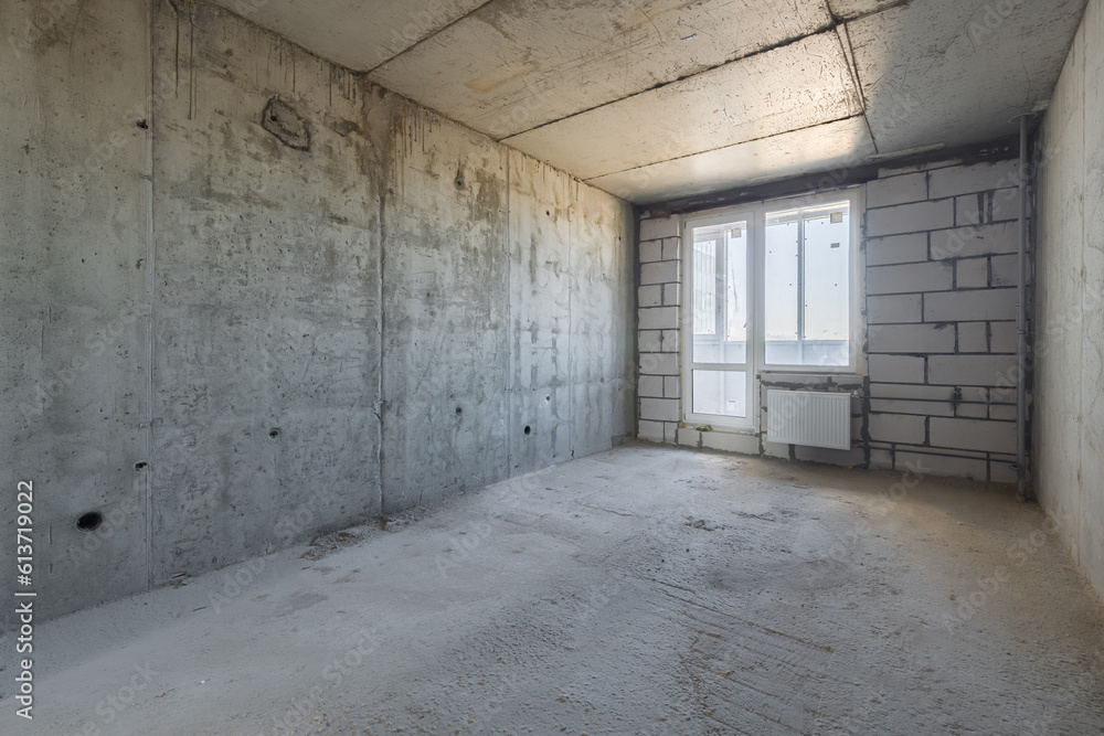 Empty concrete commercial space without finishing with partitions