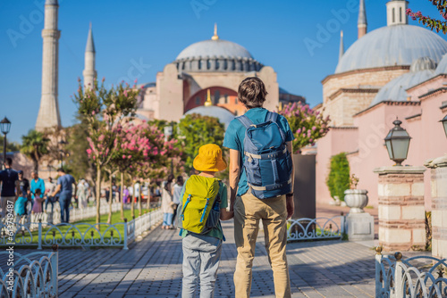 Photography Father and son Tourists enjoy beautiful view on Hagia Sophia Cathedral, famous islamic Landmark mosque, Travel to Istanbul, Turkey