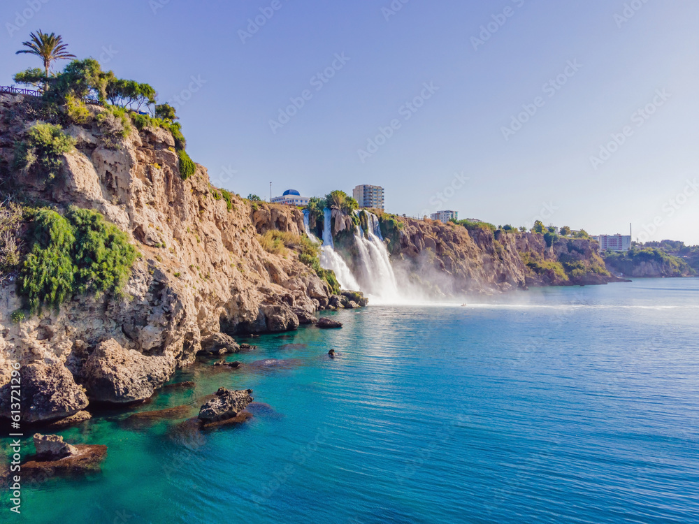 Fototapeta premium Lower Duden Falls drop off a rocky cliff falling from about 40 m into the Mediterranean Sea in amazing water clouds. Tourism and travel destination photo in Antalya, Turkey. Turkiye.