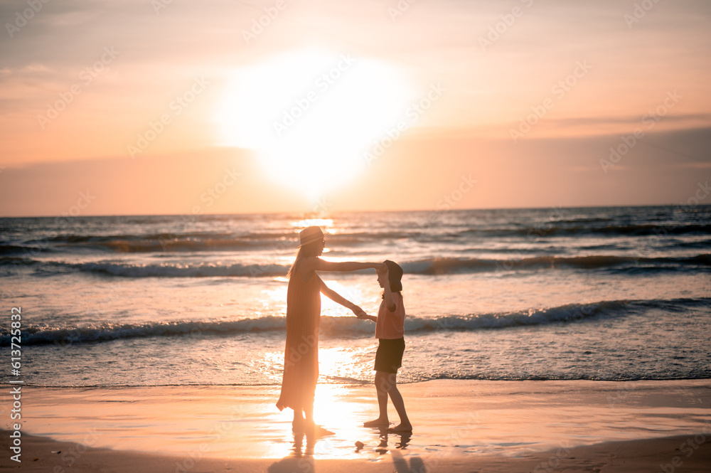 Fototapeta premium child, mother, summer, beach, person, sunset, family, happy, woman, vacation, sea, daughter, together, girl, holiday, lifestyle, fun, little, joy, female, young, childhood, water, outdoor, silhouette,