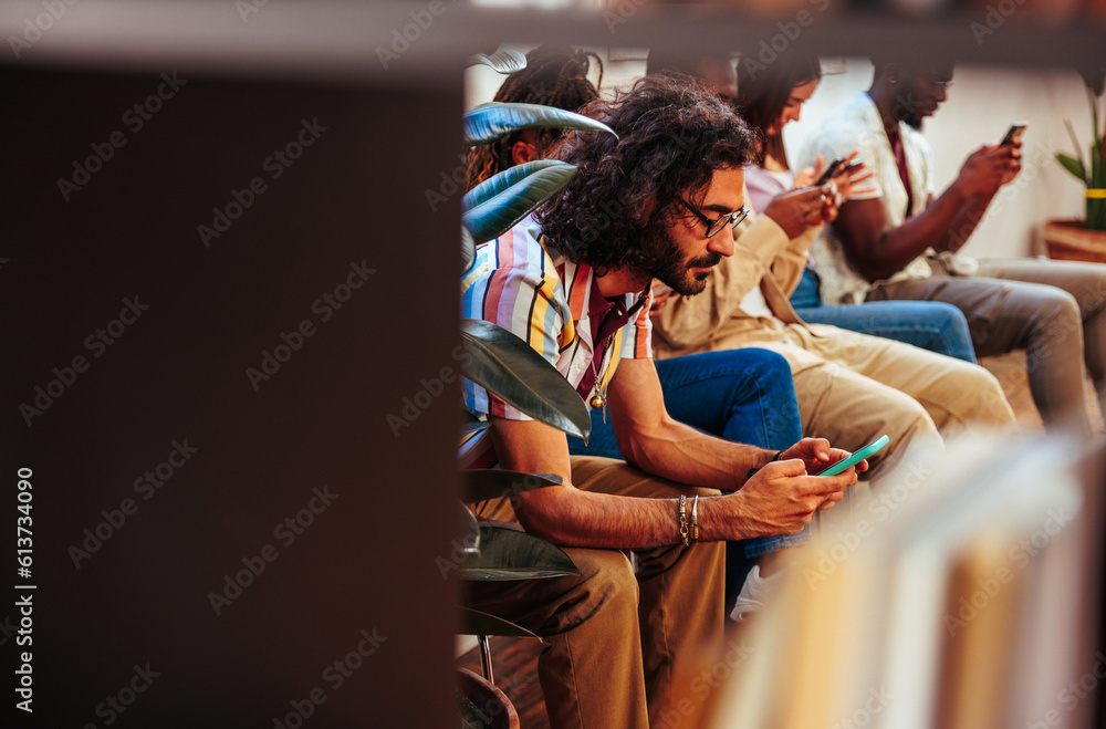 Bearded Caucasian man in 30s using phone