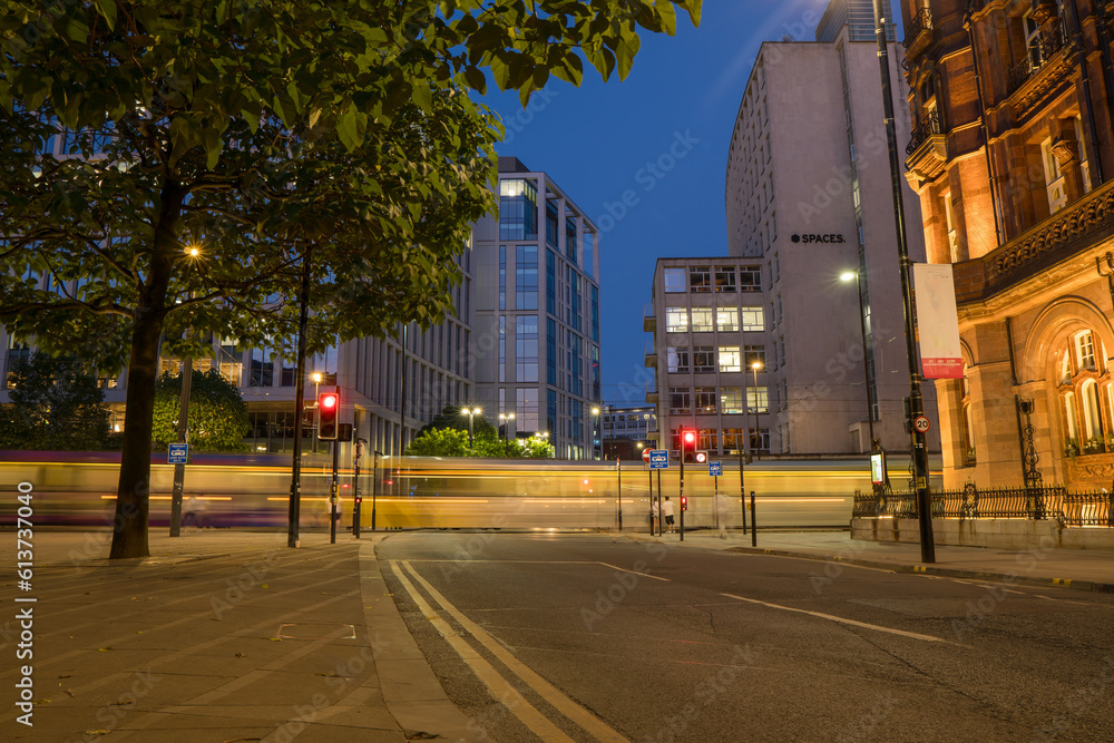 Manchester Peter Square long exposure photo of a tram crossing the square towards deansgate, Manchester Peter Square long exposure photo of a tram crossing the square towards deansgate,