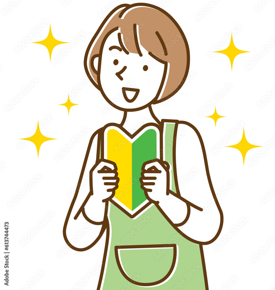 笑顔で初心者マークを持つエプロン姿の若い女性