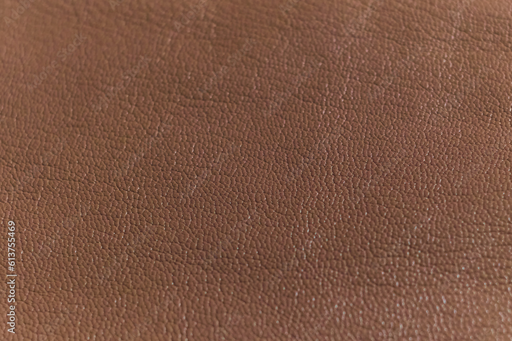 Fototapeta premium detailed view of a luxurious brown leather piece, highlighting the intricate patterns and natural feel. Timeless Elegance