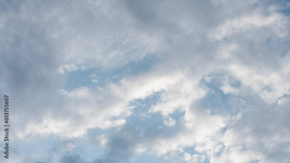 Running Clouds at the Zenith. Time-Lapse. The camera is directed vertically upwards. Clouds run fast at different heights and have different colors Running Clouds at the Zenith. Time-Lapse. The camera is directed vertically upwards. Clouds run fast at different heights and have different colors