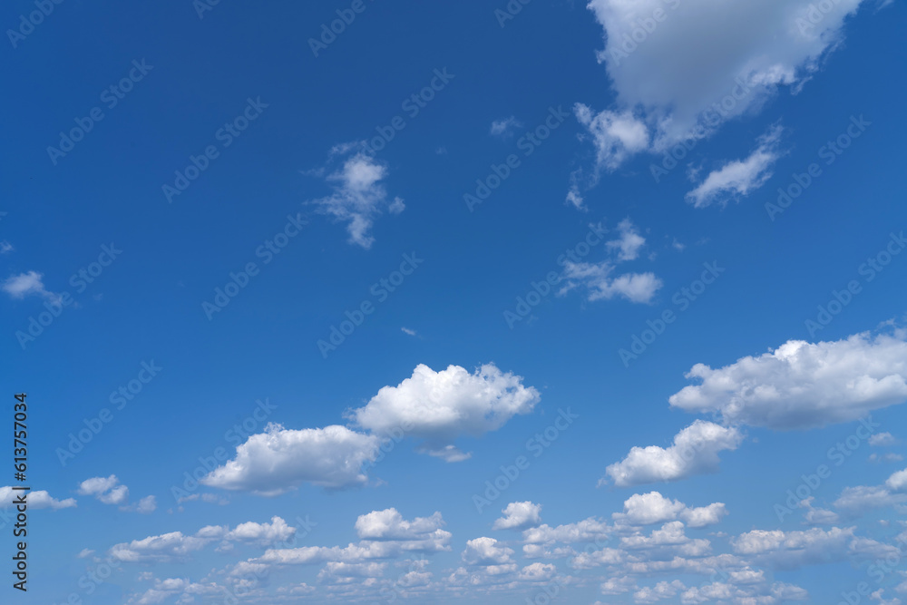 white fluffy clouds standing out against a black background and a blue sky white fluffy clouds standing out against a black background and a blue sky