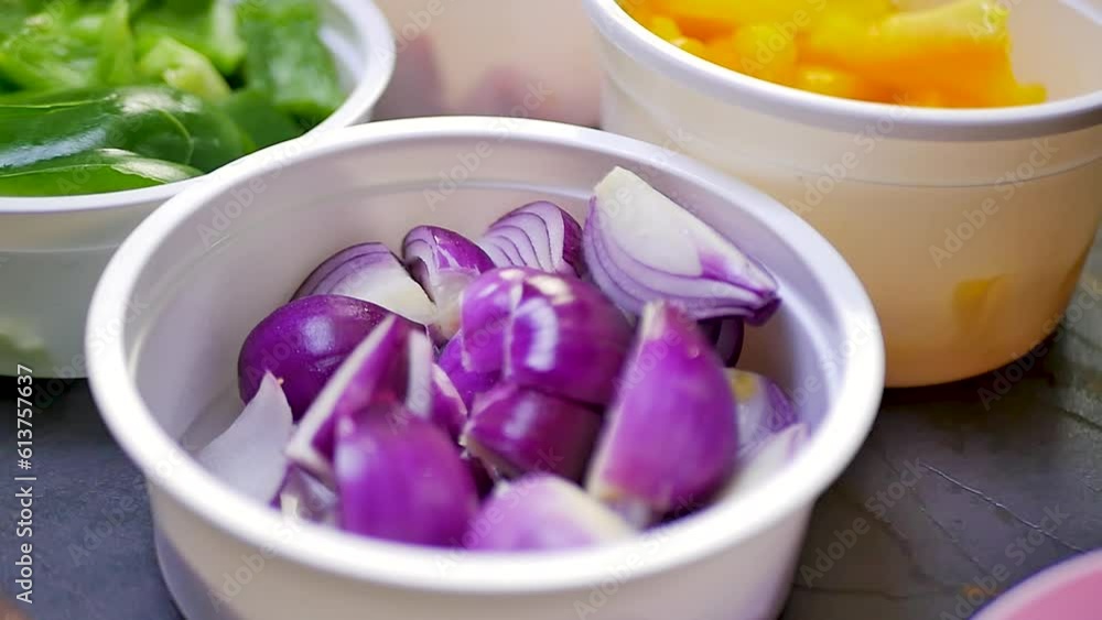 chopped onions elegantly arranged in a bowl, displaying their aromatic and flavorful essence. chopped onions elegantly arranged in a bowl, displaying their aromatic and flavorful essence.