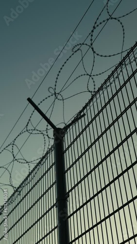 Wallpaper Mural Vertical shot of barbed wire on fence at entrance of industrial port	
 Torontodigital.ca