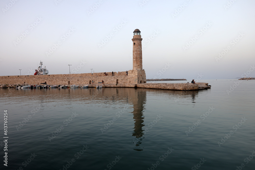  View of the lighthouse in the Old Venetian Harbor  of Rethymnon. Crete, Greece