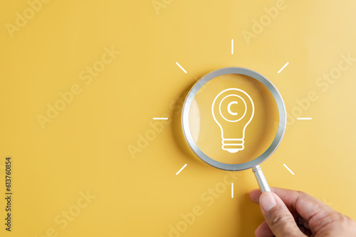 Konstfotografi Copyright protect idea concept, author rights and patent intellectual property, Copyright icon inside light bulb