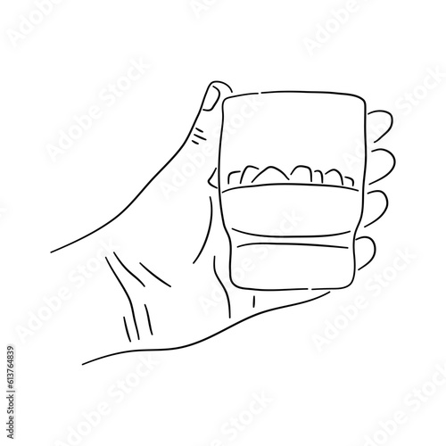Glass of whiskey in hand. Vector hand drawn illustration.