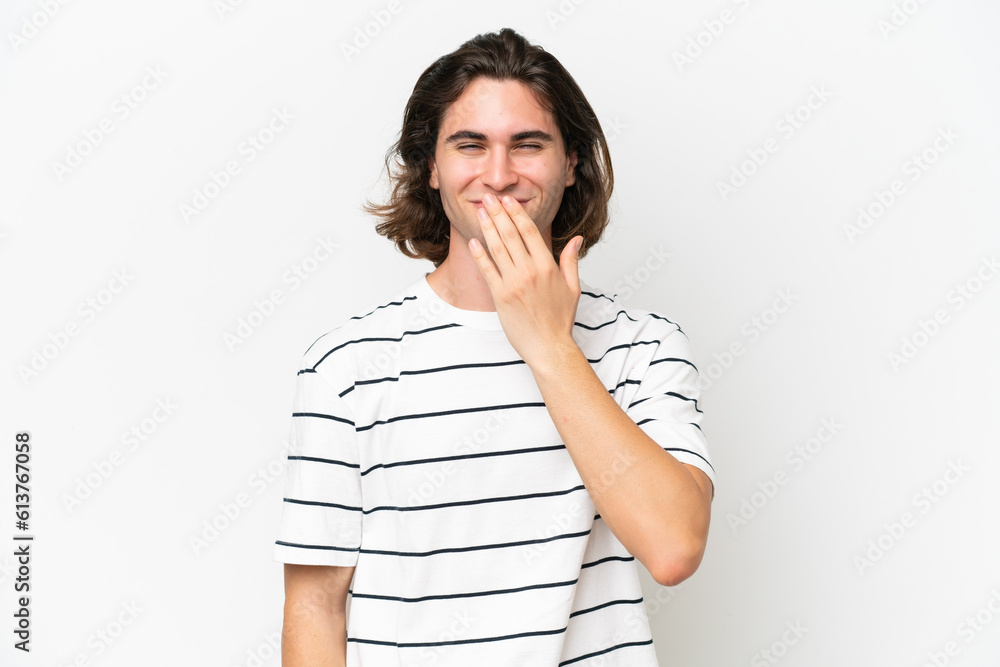 Young handsome man isolated on white background happy and smiling covering mouth with hand Young handsome man isolated on white background happy and smiling covering mouth with hand
