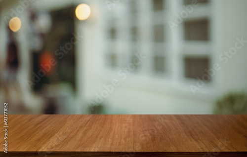 Empty wood table top and blur of out door garden background Empty wooden table space for text marketing promotion. blank wood table copy space for background
