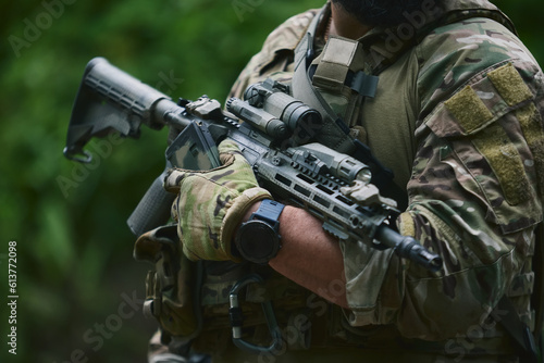 Ukrainian soldier equipped with modern assault rifle. Armed forces of Ukraine training on the shooting range outdoor. photo