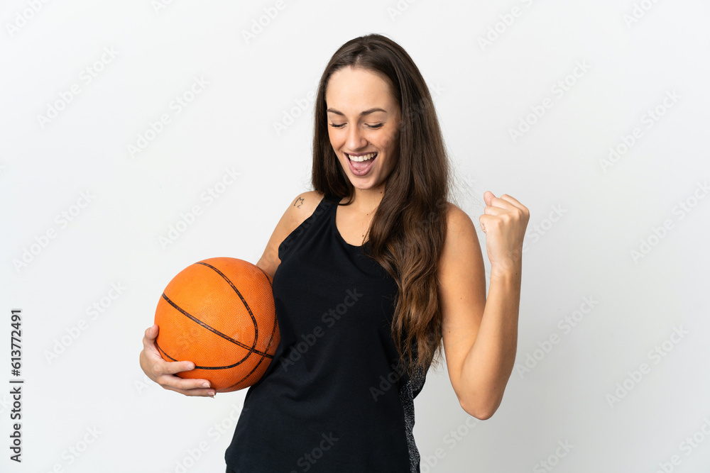 Young hispanic woman over isolated white background playing basketball Young hispanic woman over isolated white background playing basketball