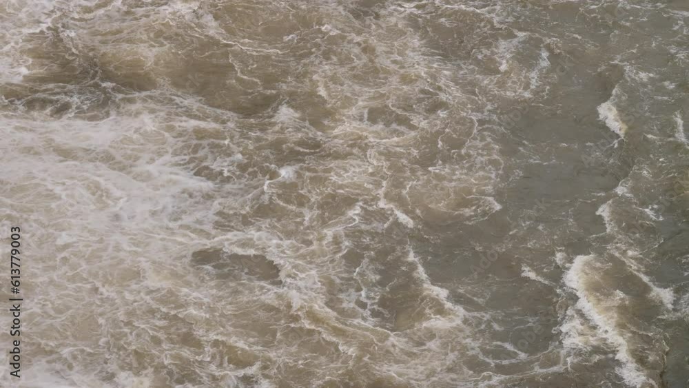 Handheld shot of Hinze Dam water flows under heavy rain during La Niña, Gold Coast Hinterland, Queensland, Australia Handheld shot of Hinze Dam water flows under heavy rain during La Niña, Gold Coast Hinterland, Queensland, Australia