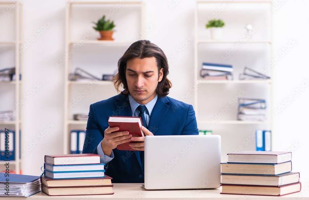 Young businessman student studying at workplace