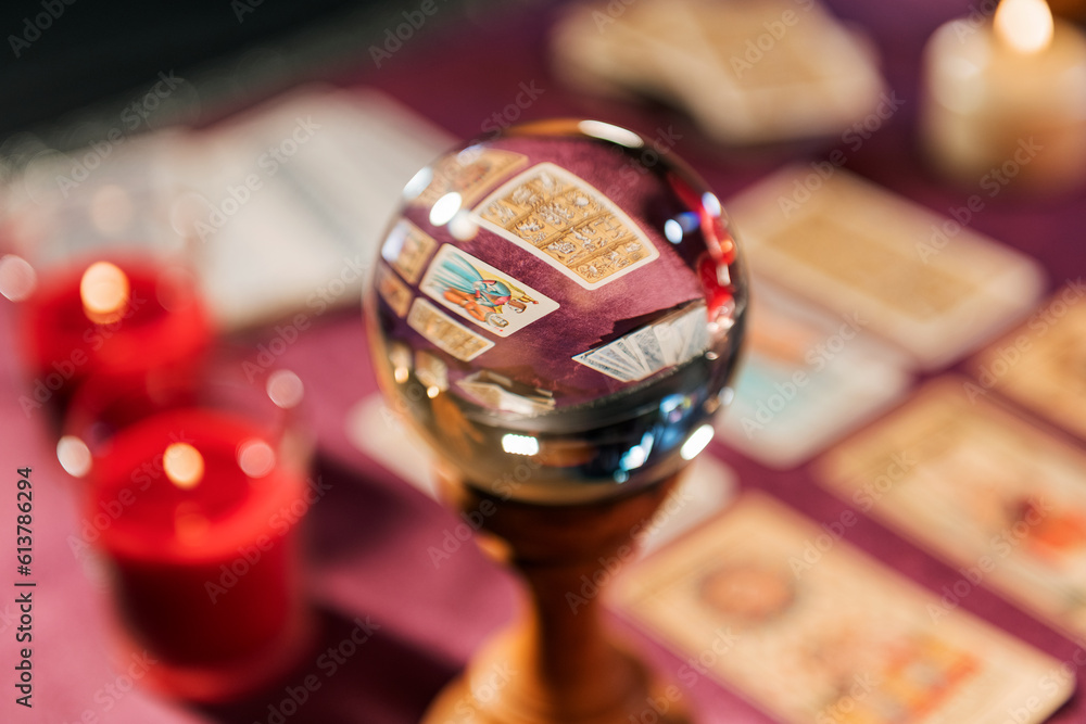 Fortune teller crystal ball on tarot table Fortune teller crystal ball on tarot table
