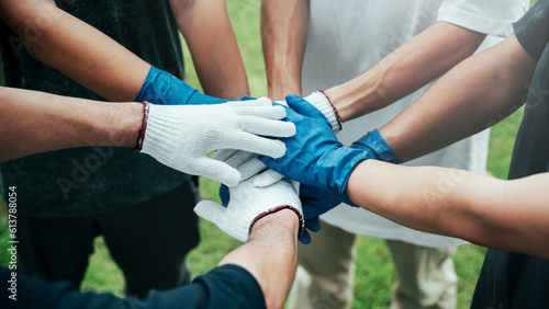 teamwork unity concept A group of friends joined hands in a campaign to help the community collect garbage. To conserve nature and the environment, love the world