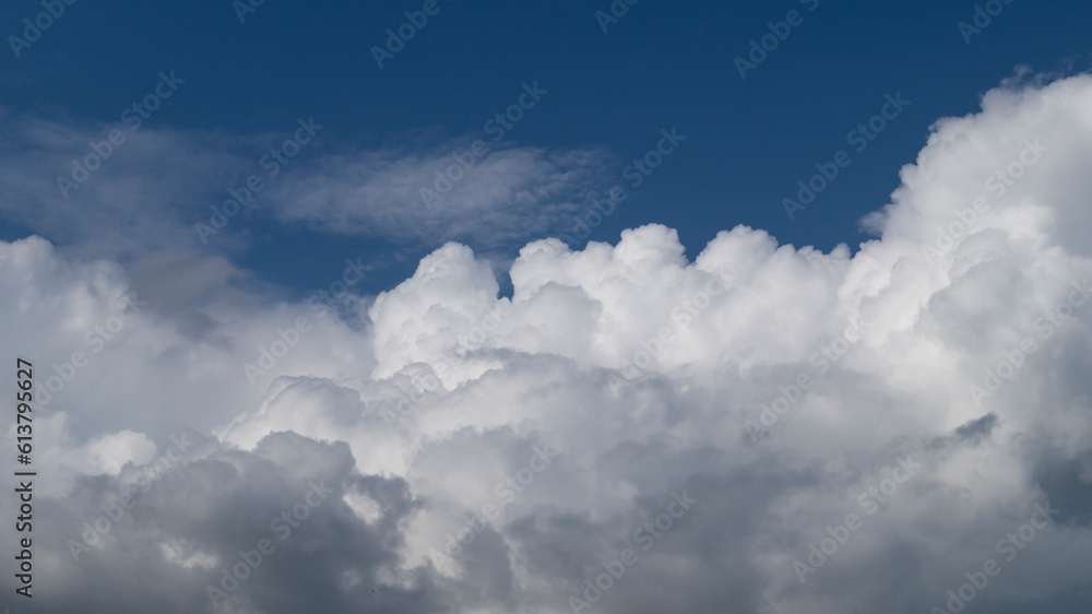Blue clouds in the sky. White fluffy clouds. Clouds close-up Blue clouds in the sky. White fluffy clouds. Clouds close-up