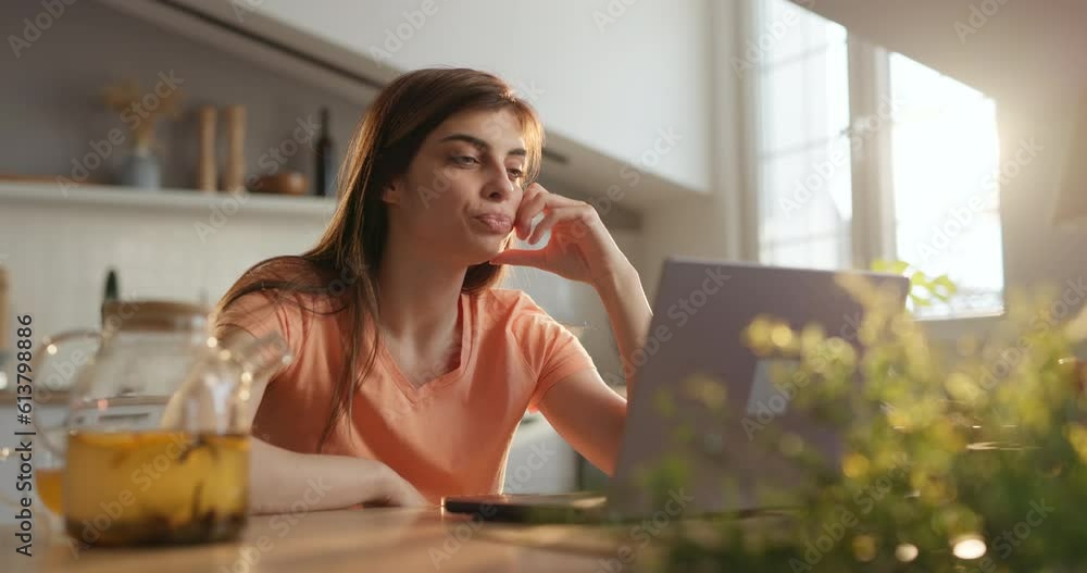 Sleepy female student yawns, surf internet with smartphone, look on laptop Sleepy female student yawns, surf internet with smartphone, look on laptop