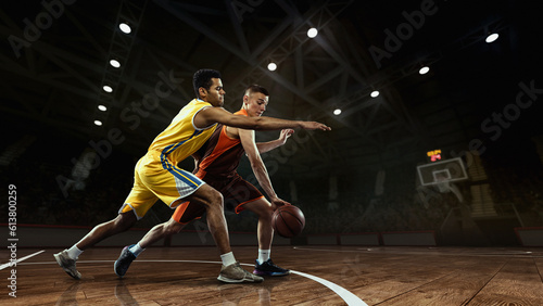 Basketball match. Professional two basketball players in action with ball at 3d model sports arena.