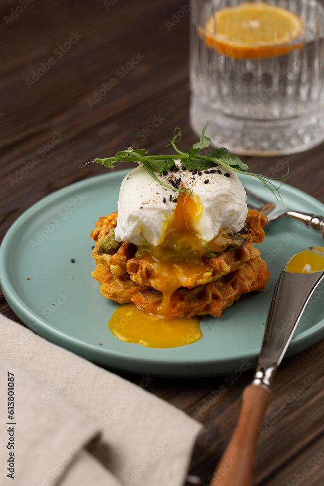 Sweet potato waffles with avocado and poached egg