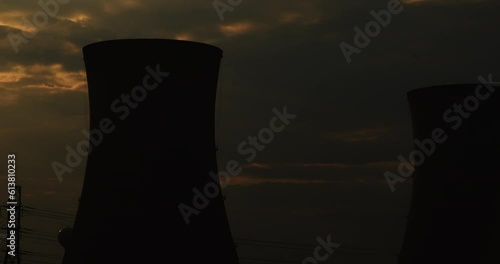 Single Nuclear Cooling Tower In Silhouette Just Before Dark photo