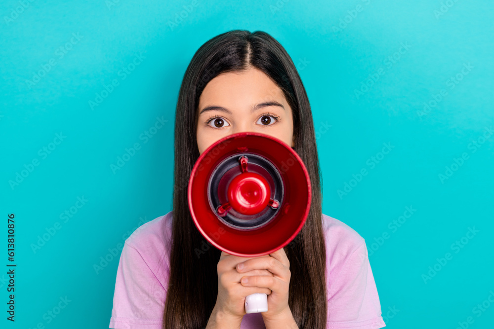 Fototapeta premium Photo of little schoolgirl wear pink t-shirt hold megaphone screaming announce opening new kids event isolated on cyan color background