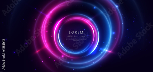 Abstract technology futuristic circles neon glowing blue and pink light lines with speed motion blur effect on dark blue background.