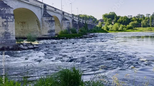 River Loire fast flowing underneath the bridge Wilson in Tours France, an area is birds paradise photo
