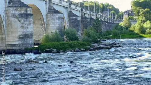 Slow moving water of river Loire under the bridge Wilson in Tours France photo