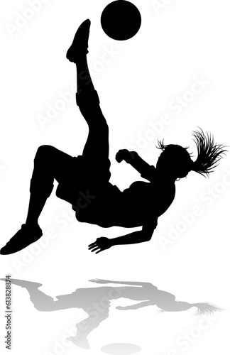 A female soccer football player woman in silhouettes