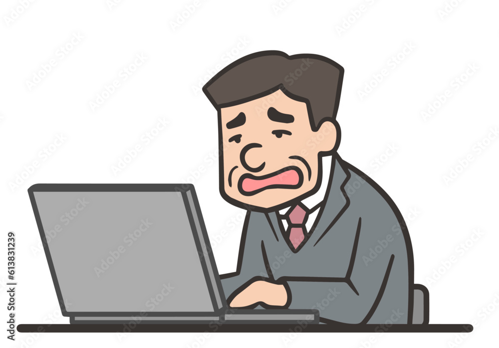 仕事が忙しくて残業する中年の男性社員 仕事が忙しくて残業する中年の男性社員
