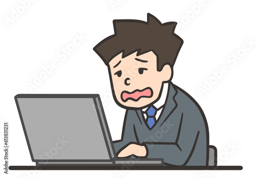 仕事が忙しくて残業する男性社員