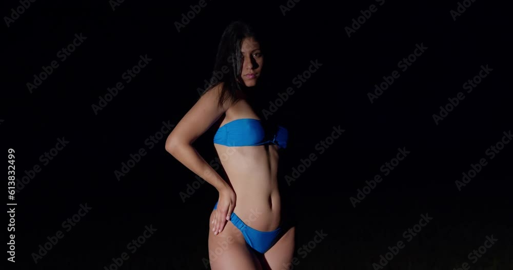 Adorned in a captivating blue bikini in the enchanting tapestry of the night, a young Latina embraces the serenity, adorned in a captivating blue bikini. Adorned in a captivating blue bikini in the enchanting tapestry of the night, a young Latina embraces the serenity, adorned in a captivating blue bikini.