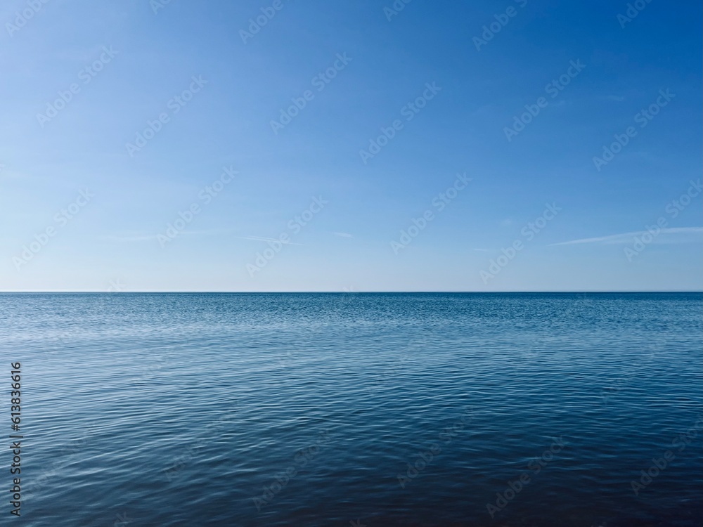 Blue sea horizon, natural seascape background, shining sea surface