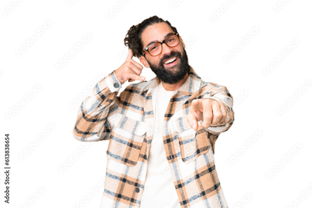 Young man with beard over isolated chroma key background making phone gesture and pointing front Young man with beard over isolated chroma key background making phone gesture and pointing front